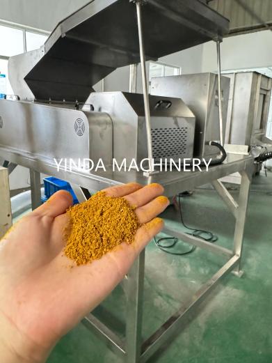Yellow coarsely ground turmeric test sample after YDCS crushing