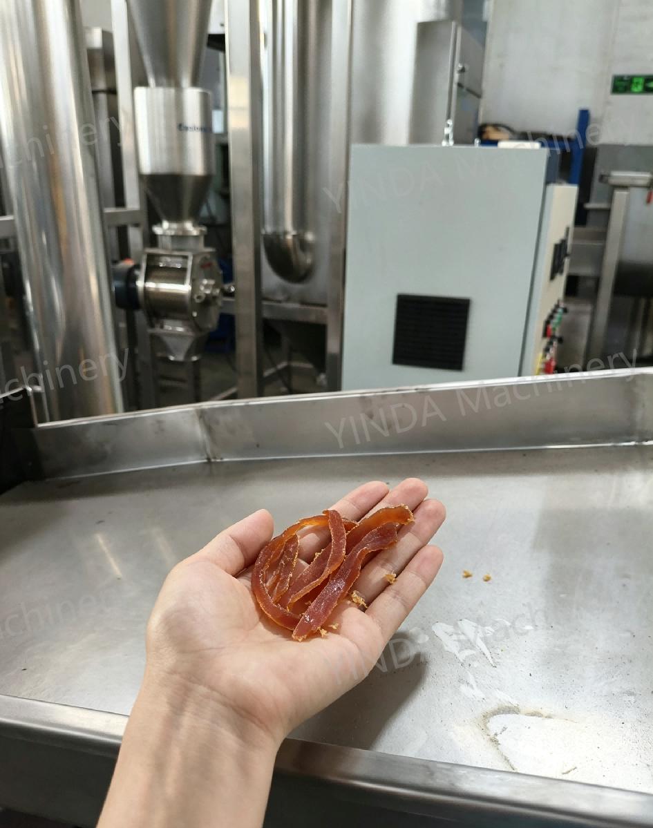 Fibrous pet jerky strips held before hammer milling