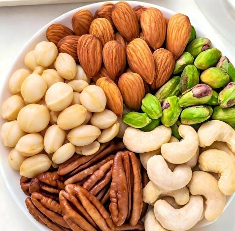 Assorted almonds, peanuts, pistachios, pecans and cashews for nut processing