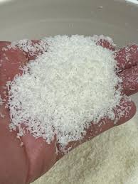 Ground coconut powder sample showing the finished particle texture