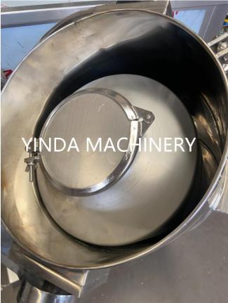 Interior view of a stainless steel powder mixing container and sealed access cover